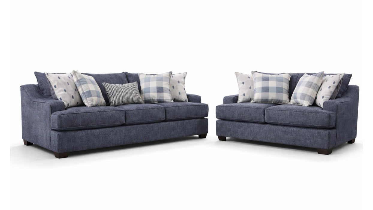 Bluesky sofa and loveseat set in denim blue fabric with plaid and dotted pillows