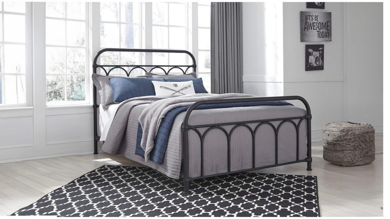 Nashburg black metal full bed staged in a bright bedroom
