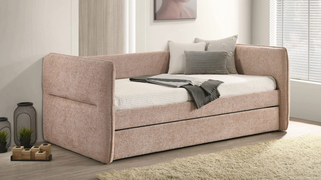 Philpa blush pink twin day bed with trundle closed in a bedroom