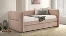 Philpa blush pink twin day bed with trundle closed in a bedroom