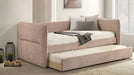 Philpa blush pink twin day bed with trundle pulled out in a bedroom